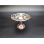 An Edwardian silver circular pedestal bonbon dish, having pierced decoration, Birmingham 1909,