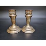 A pair of American candlesticks by Reed & Barton, stamped 'Sterling 91S', 13cm high (weighted).