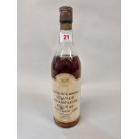 A 24 fl.oz. bottle of J & B 1922 vintage Grande Champagne Cognac.