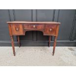 An early 19th century mahogany concave fronted table, in the manner of Gillows, 104.5cm wide.