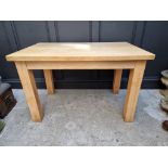 A modern pale oak kitchen table, 122cm long.