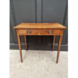 A George III mahogany and line inlaid two drawer side table, 76.5cm wide.