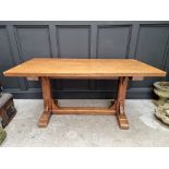 An oak trestle table, on chamfered supports, 152.5cm long.