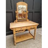 An antique pine mirror back dressing table, 107.5cm wide.