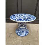 A blue and white porcelain conservatory pedestal table, 42cm high x 52cm diameter.