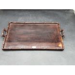 A Chinese carved hardwood twin handled rectangular tray, with simulated bamboo decoration, 57cm