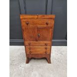 A George III mahogany and line inlaid wash stand, enclosing a rising mirror, 45cm wide.