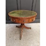 A small George III and later mahogany drum top library table, with leather inset surface above three