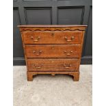 An 18th century oak three drawer chest, with moulded frieze, 89.5cm wide.