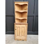 An antique pine standing corner cupboard, 170.5cm high x 64cm wide.