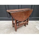 An antique oak gateleg table, 89cm wide.