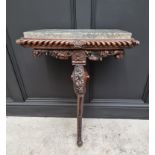 An interesting 19th century carved oak console table, with green marble top above a gadrooned frieze