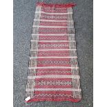 A Persian rug, having geometric design allover, 172 x 65cm.