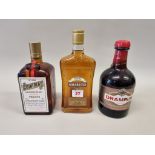 A 24 fl.oz. bottle of Cointreau, probably 1970s bottling; together with a 70cl Drambuie; and a