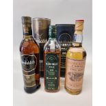 Three bottles of whisky, comprising: Glenfiddich 18 year old, in card tube; a Bushmills 10 year old,