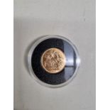 Coins: a George V 1916 gold sovereign, Perth mint.