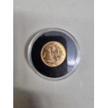 Coins: a George V 1915 gold sovereign, Sydney mint.