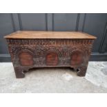 An early 18th century carved elm boarded coffer, 118.5cm wide.