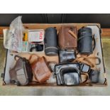 Cameras: a Voigtlander Perkeo I, in leather case; together with a Rolleicord; a Canon AE-1, with