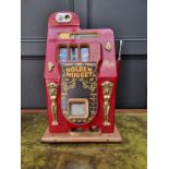 A vintage Bell's 'Golden Nugget' one arm bandit arcade machine, 65cm high.