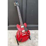 An Epiphone ES-339 hollow body electric guitar, cherry red.
