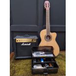 An electro-acoustic guitar, with padded bag; together with a Marshall MG15DFX amplifier; and various