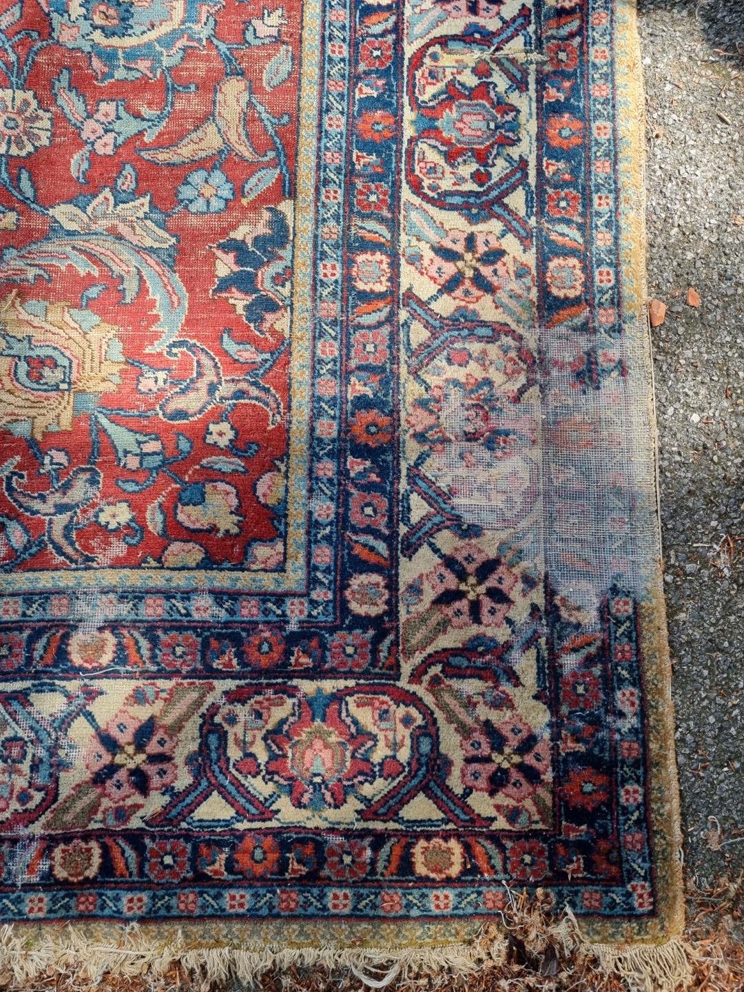 A Persian carpet, having central floral medallions, with floral cartouches to each corner of central - Image 2 of 10