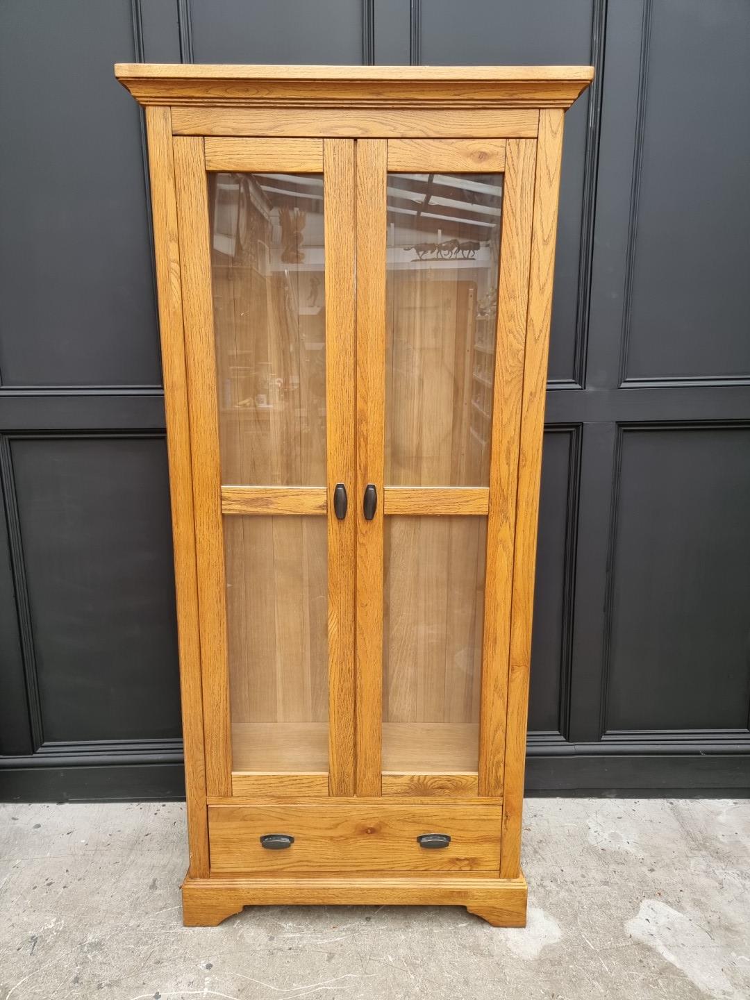 A contemporary oak bookcase, 90cm wide.