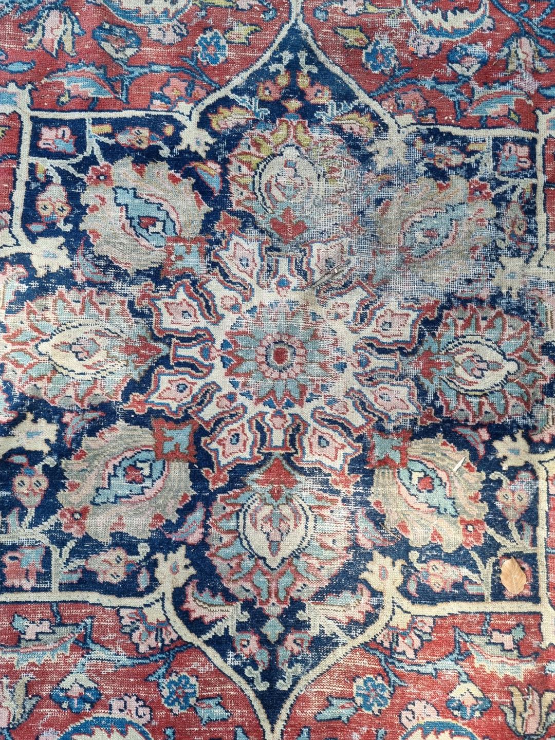 A Persian carpet, having central floral medallions, with floral cartouches to each corner of central - Image 5 of 10