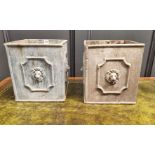 A pair of lead planters, 30cm high x 26cm wide.