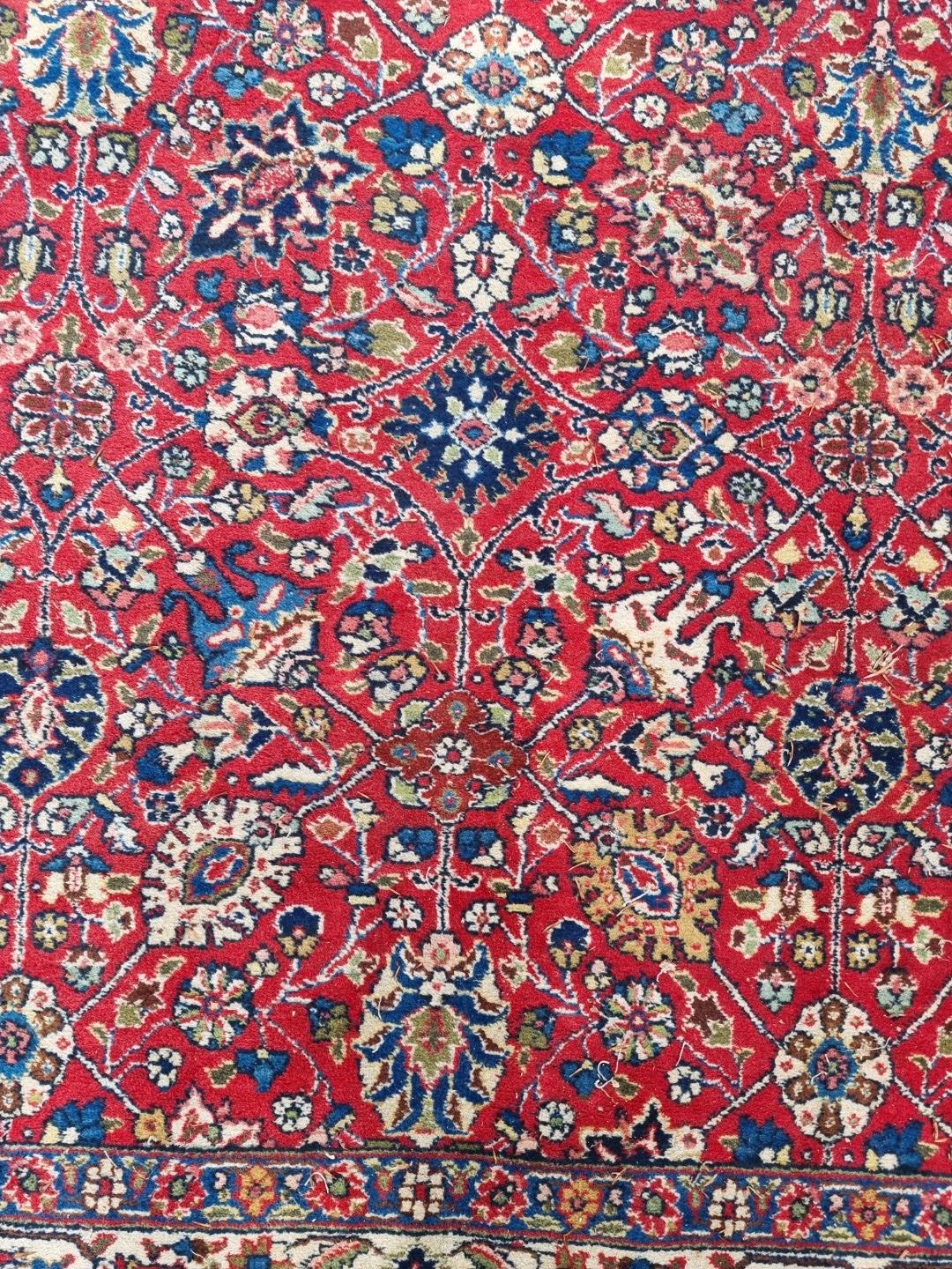 A Persian carpet, having allover floral decoration to central field, with floral borders, 295 x - Image 3 of 6