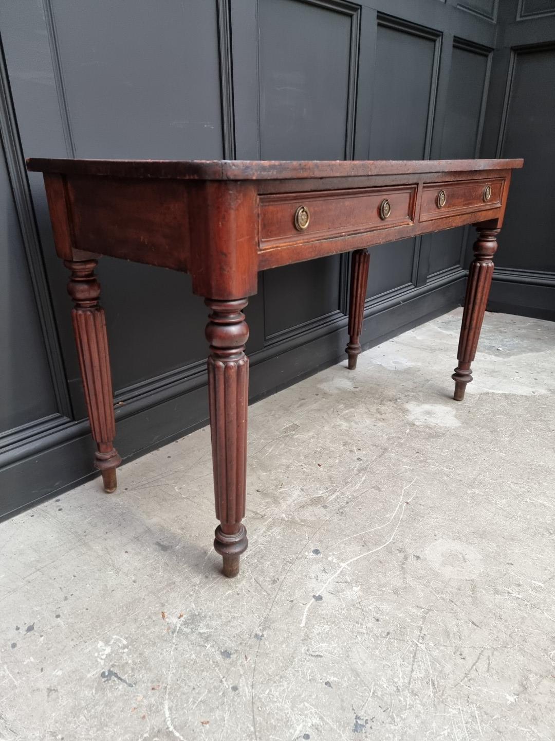 A 19th century mahogany desk, stamped 'M Willson, Great Queen St', 120.5cm wide. - Image 7 of 10