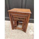 A nest of four Chinese carved hardwood quartetto tables, largest 51cm wide.