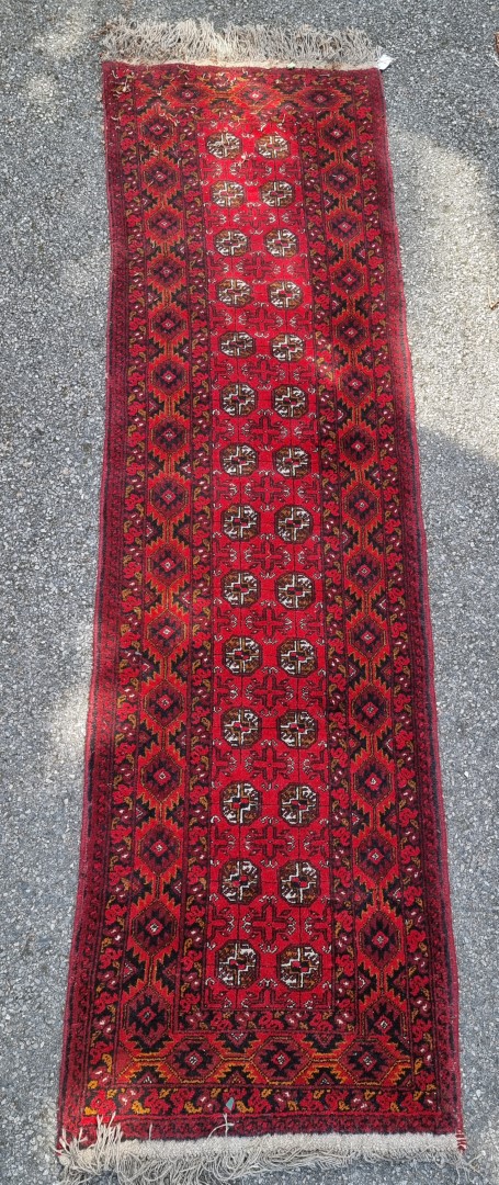 A Bokhara runner, having repeated geometric design, 290 x 82cm.