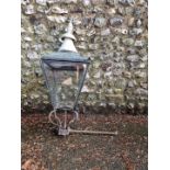 An antique wall mounting street lamp.