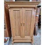 A late 19th century Continental pine armoire, 118cm wide.