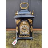 An interesting small antique ebonized table clock, the dial inscribed 'Nico Lambert, London', with