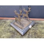 An unusual brass pen stand, with stag supports, 22cm wide.