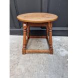 An oak circular occasional table, 53.5cm wide.