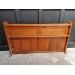 A Victorian pitch pine pew back, 162cm wide.