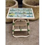 A decorative tile inset occasional table, 43cm wide. En suite with the previous lot.