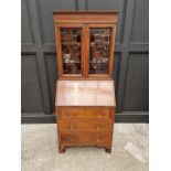 A small Edwardian mahogany and inlaid bureau bookcase, 66.5cm wide.