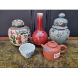 A group of Chinese ceramics, to include a Yixing wine pot and cover, largest 19cm high. (5)