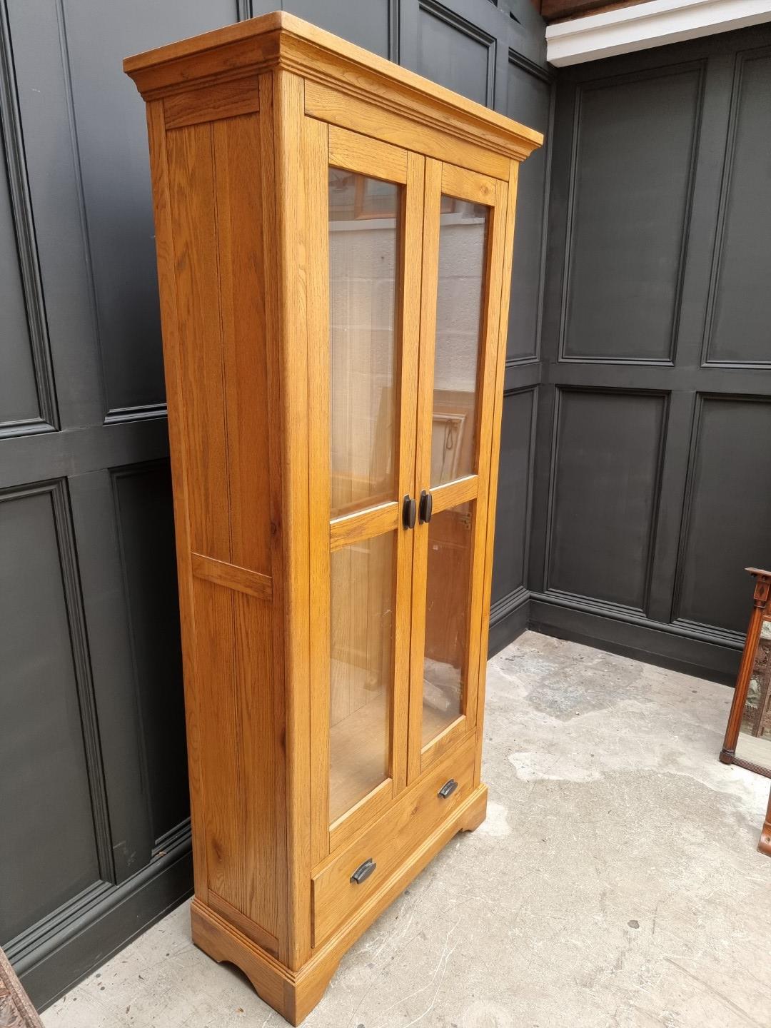 A contemporary oak bookcase, 90cm wide. - Image 2 of 10