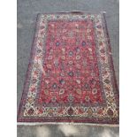 A Persian carpet, having allover floral decoration to central field, with floral borders, 295 x