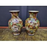 A pair of Doulton Lambeth faience vases, 32cm high.