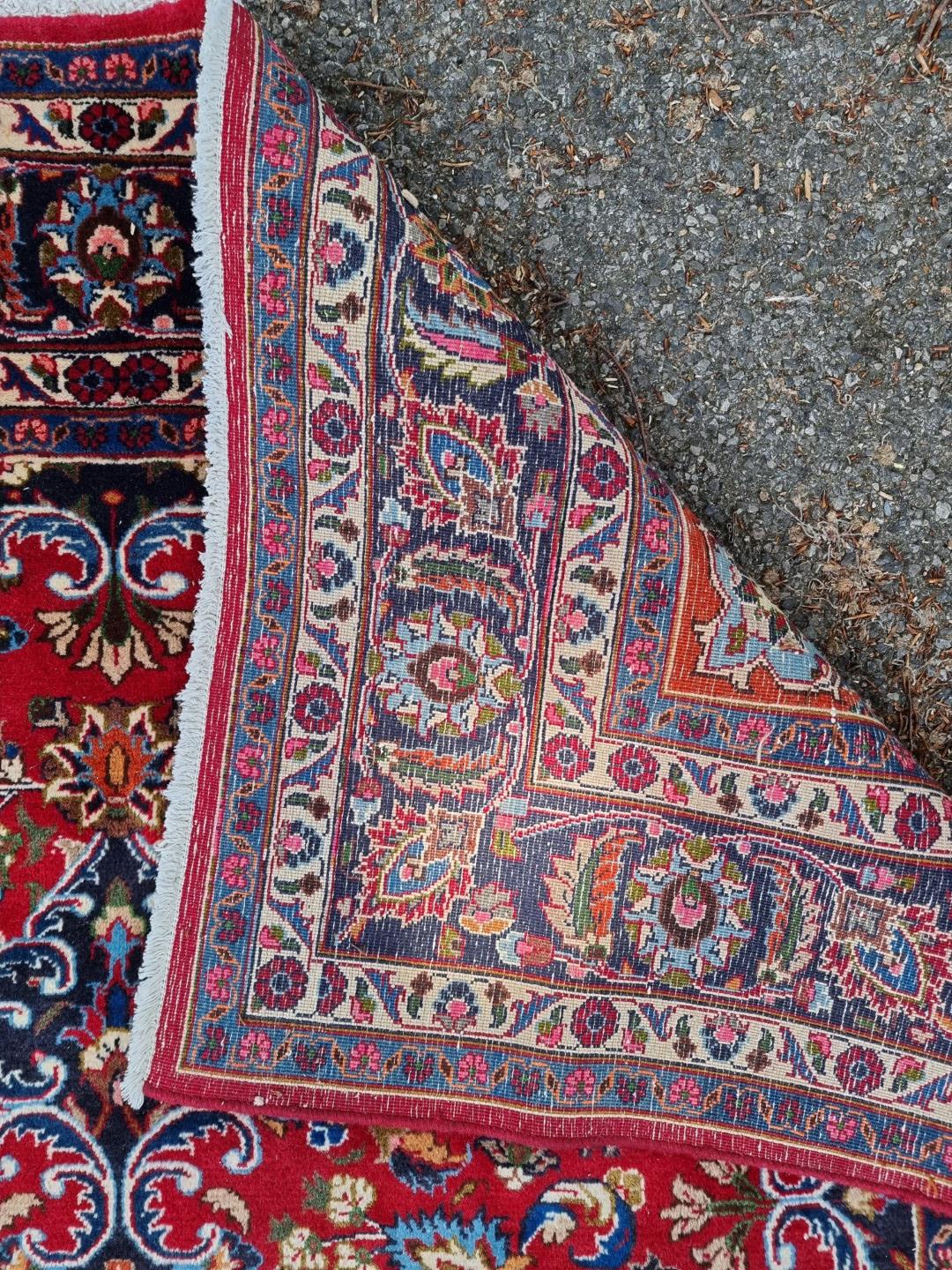 A Persian carpet, having floral central medallion, with floral cartouches to each corner, 293 x - Image 7 of 7