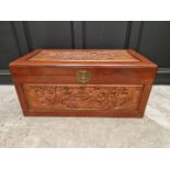 A Chinese carved camphor wood coffer, 100.5cm wide.