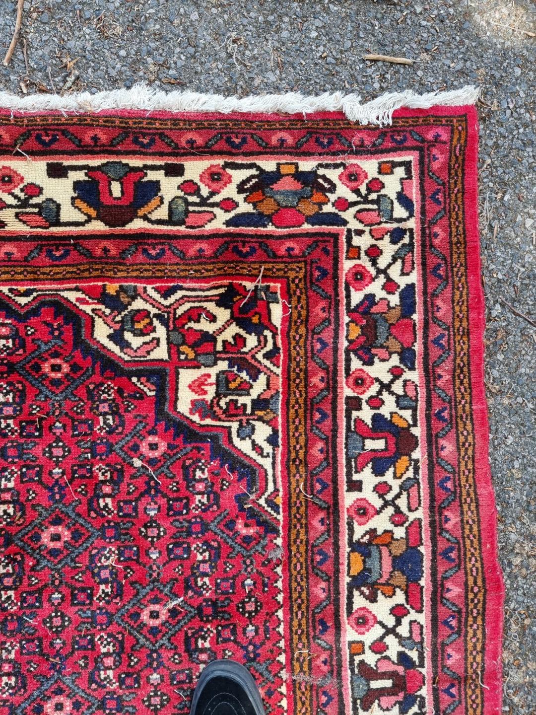 A Persian carpet, having central floral medallion, with floral decoration to central field, 392 x - Image 6 of 12