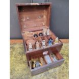 A 19th century mahogany apothecary box, enclosing various glass bottles, 25.5cm wide.